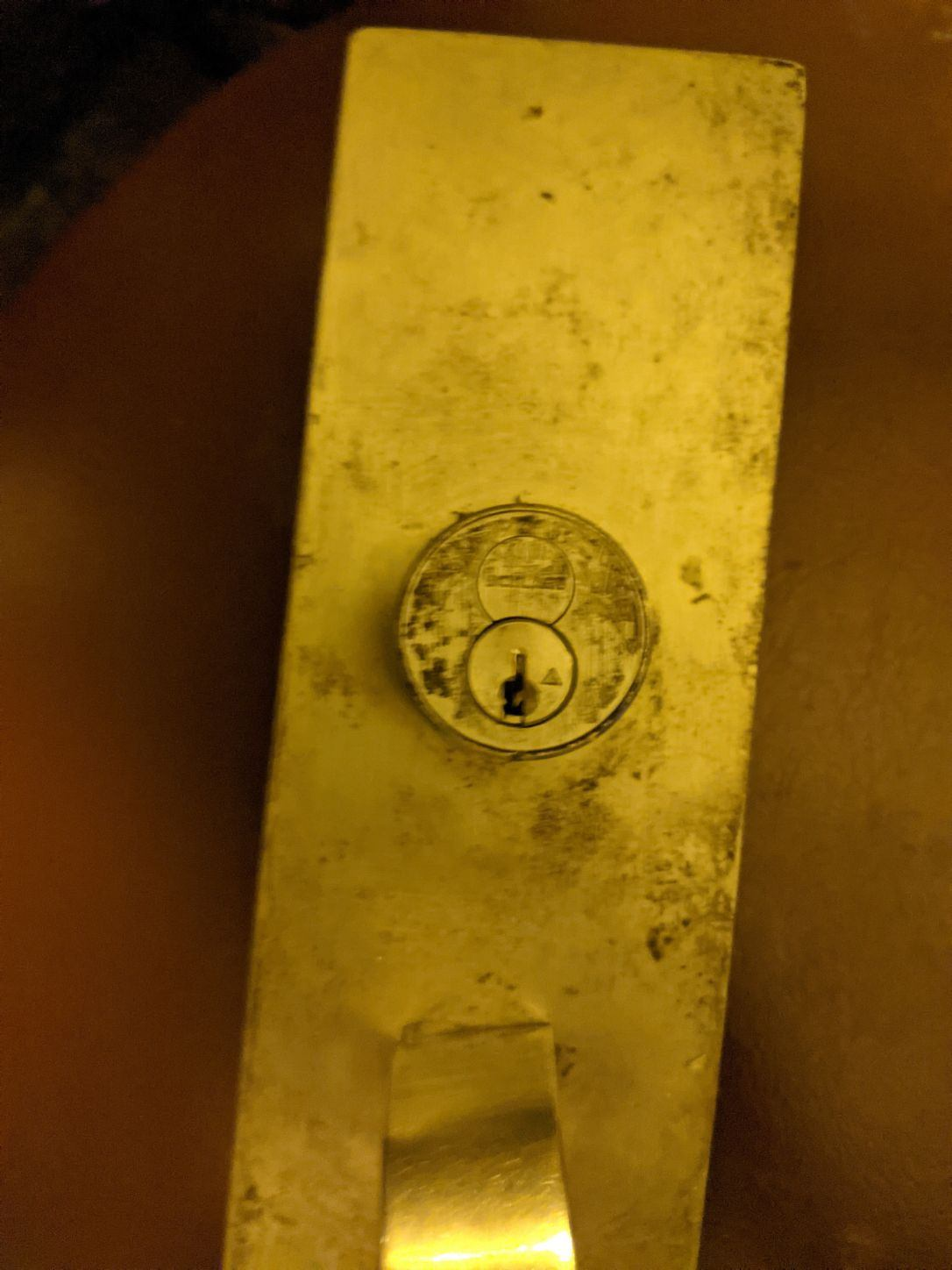 Deadbolt cylinder on brass door hardware
