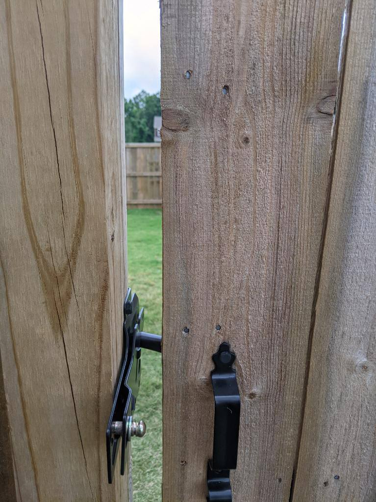 Backyard gate lock installation